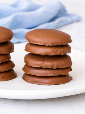 gluten free mint cookies dipped in chocolate on marble background