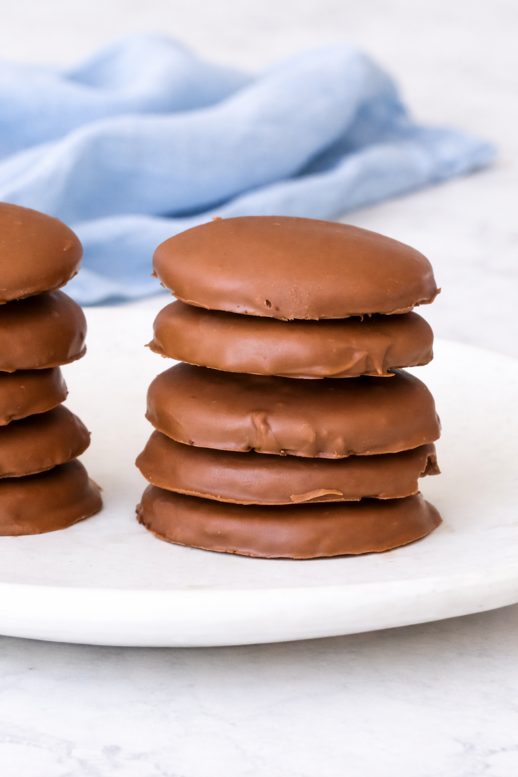 gluten free mint cookies dipped in chocolate on marble background
